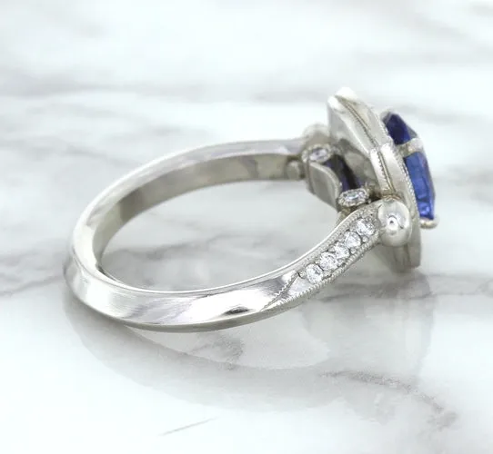 1.56ct Oval Blue Sapphire Ring with Diamond Halo in Platinum