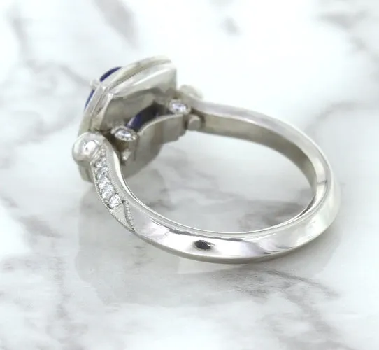 1.56ct Oval Blue Sapphire Ring with Diamond Halo in Platinum