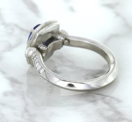 1.56ct Oval Blue Sapphire Ring with Diamond Halo in Platinum