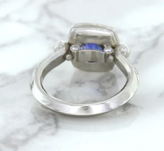 1.56ct Oval Blue Sapphire Ring with Diamond Halo in Platinum