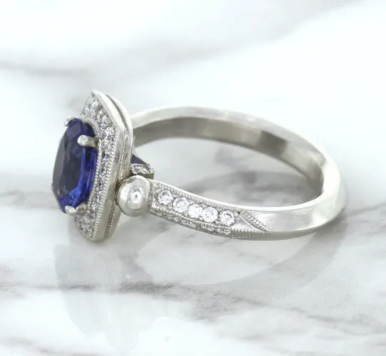 1.56ct Oval Blue Sapphire Ring with Diamond Halo in Platinum