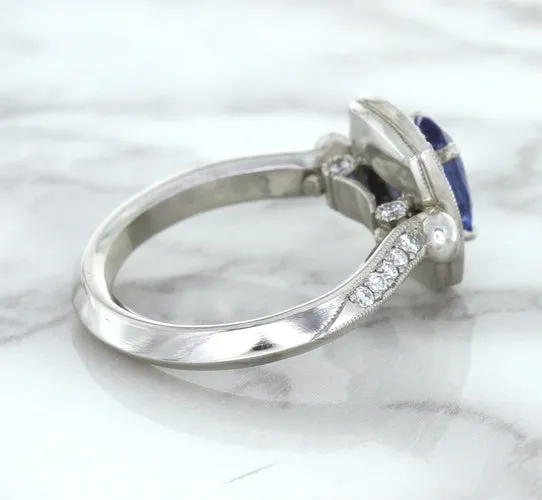 1.56ct Oval Blue Sapphire Ring with Diamond Halo in Platinum