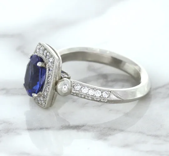 1.56ct Oval Blue Sapphire Ring with Diamond Halo in Platinum