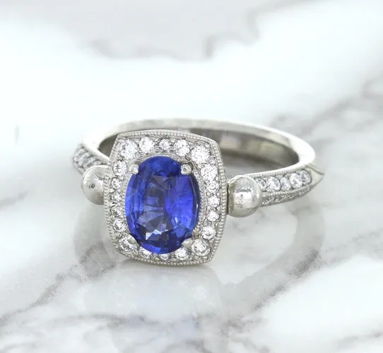 1.56ct Oval Blue Sapphire Ring with Diamond Halo in Platinum