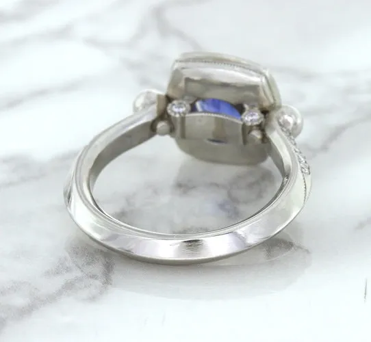 1.56ct Oval Blue Sapphire Ring with Diamond Halo in Platinum