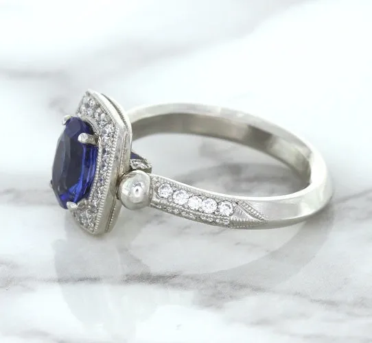 1.56ct Oval Blue Sapphire Ring with Diamond Halo in Platinum