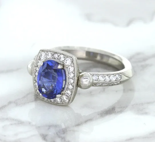 1.56ct Oval Blue Sapphire Ring with Diamond Halo in Platinum
