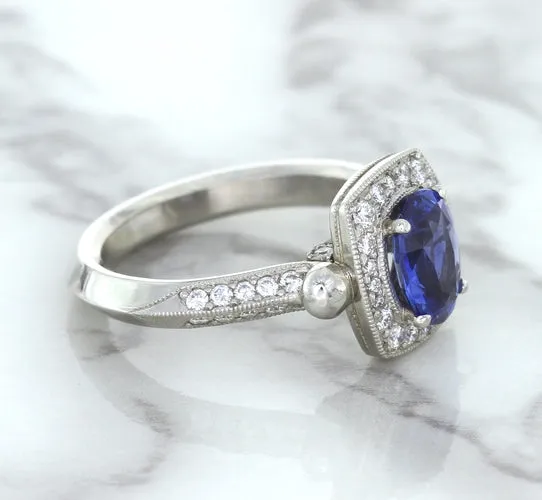 1.56ct Oval Blue Sapphire Ring with Diamond Halo in Platinum
