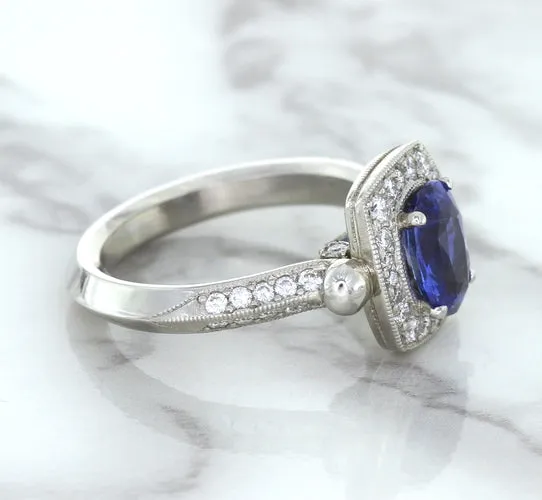 1.56ct Oval Blue Sapphire Ring with Diamond Halo in Platinum