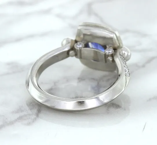 1.56ct Oval Blue Sapphire Ring with Diamond Halo in Platinum