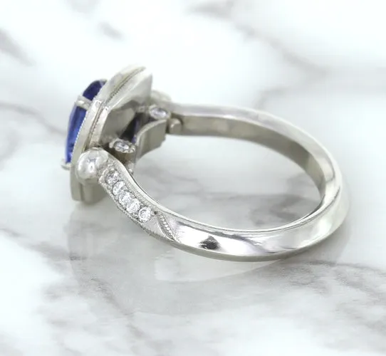 1.56ct Oval Blue Sapphire Ring with Diamond Halo in Platinum