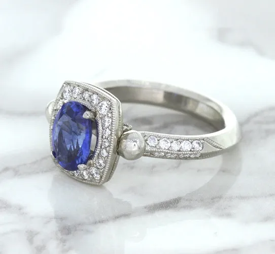 1.56ct Oval Blue Sapphire Ring with Diamond Halo in Platinum