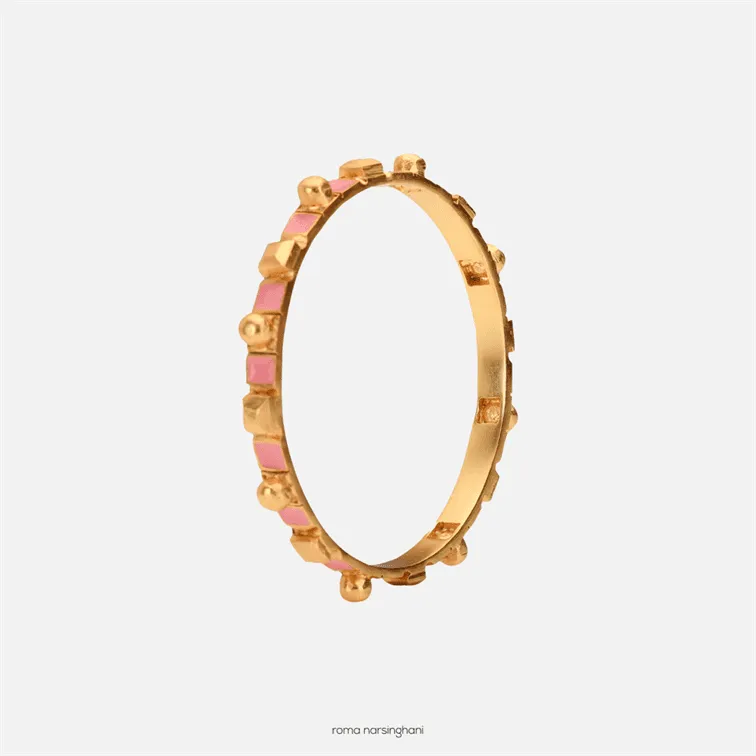 Roma Narsinghani Meena bangle The piece is set in brass, hand enameled with 18KT gold finesse. Each piece is unique and handcrafted by our artisans. RNLOVE01