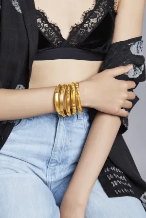 Roma Narsinghani Meena bangle The piece is set in brass, hand enameled with 18KT gold finesse. Each piece is unique and handcrafted by our artisans. RNLOVE01