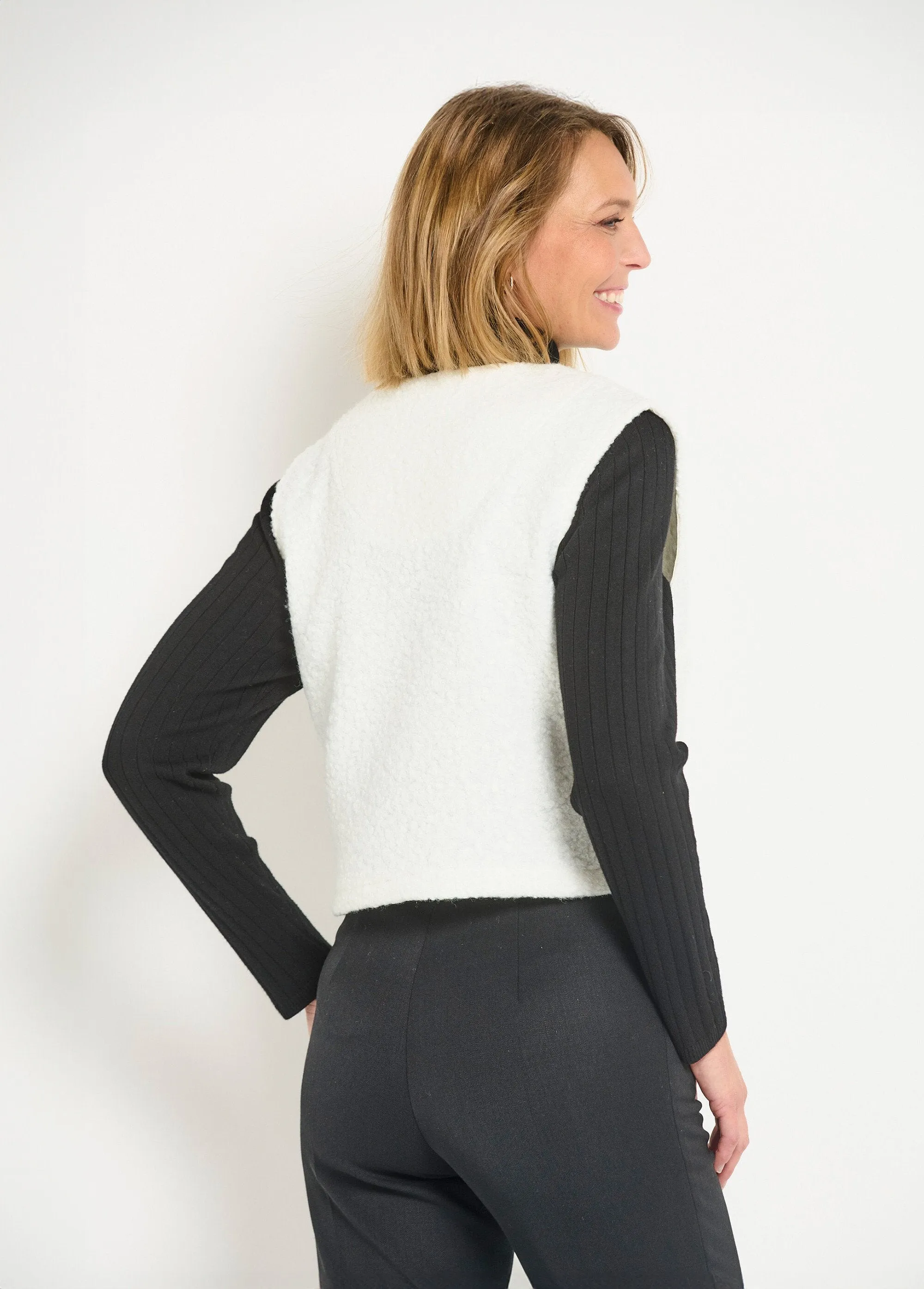 Sleeveless zipped vest with a woolly feel