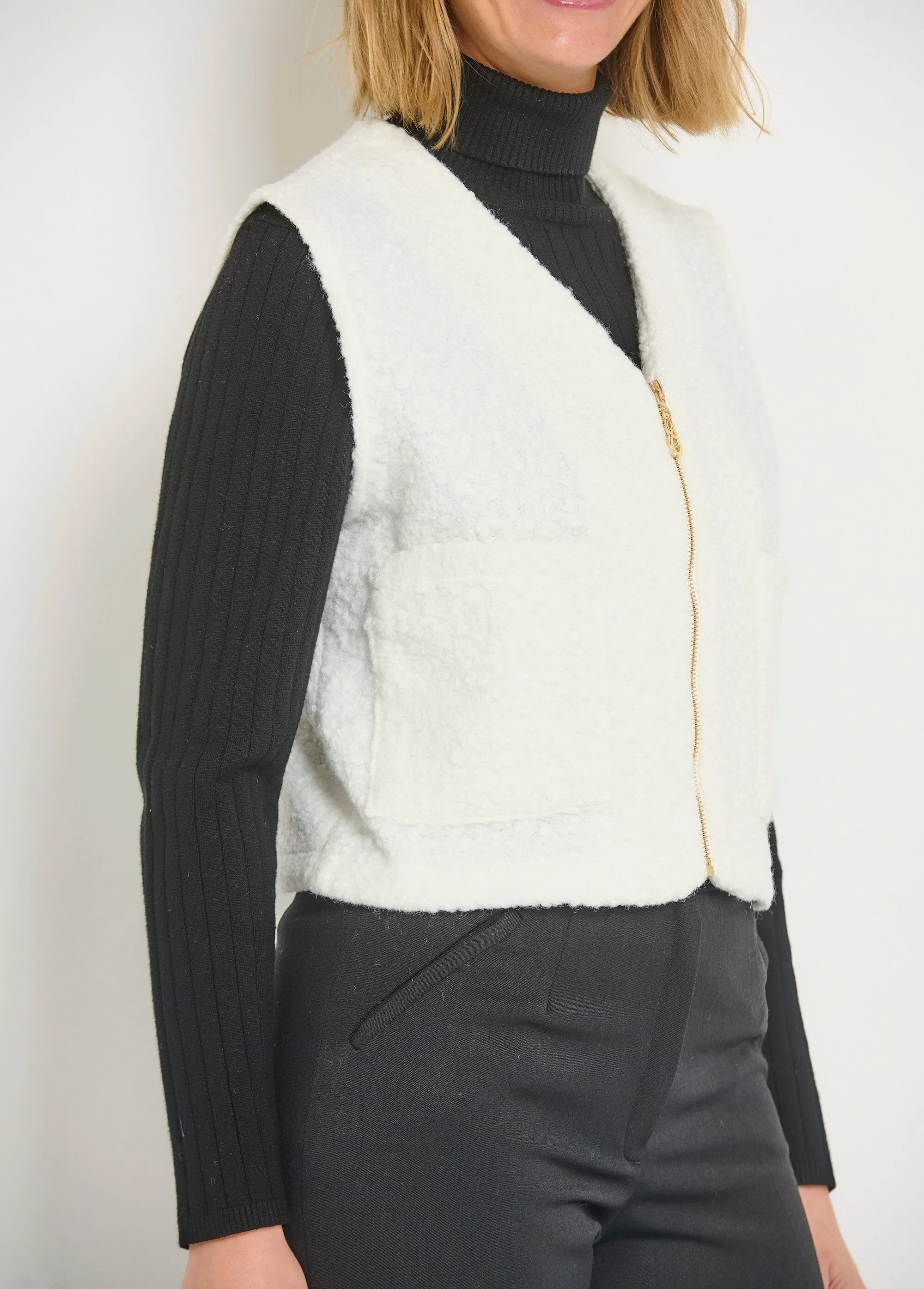 Sleeveless zipped vest with a woolly feel